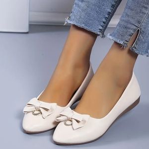 Women's beige bow and rhinestone flats size 6/6.5